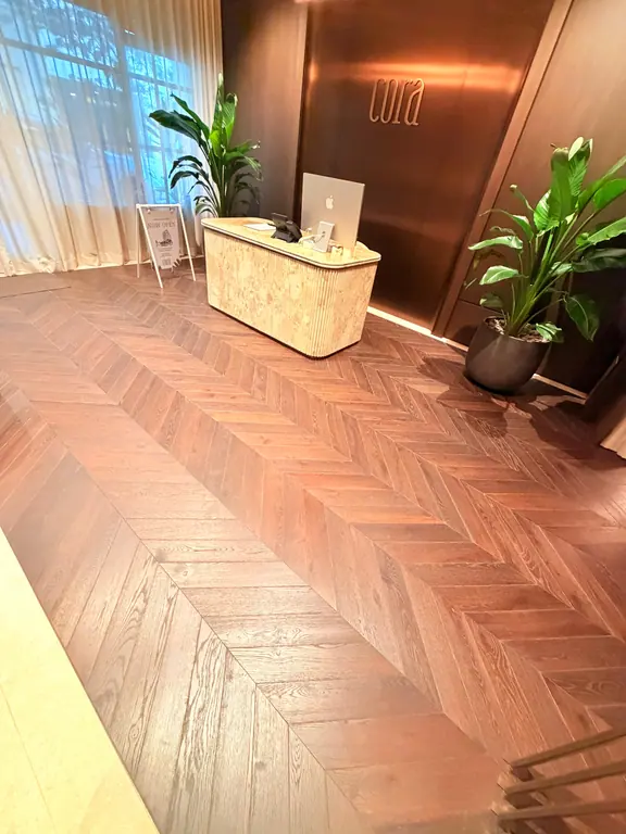 Herringbone floor and finished interior after a Canes Cleaners project